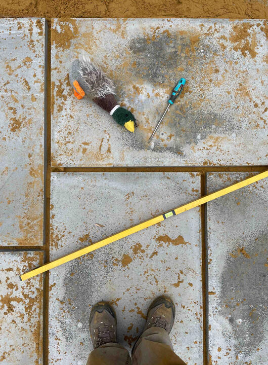 A new concrete surface under construction — part of the permeable surface network that allows rainwater to soak naturally into the ground. Construction detail of a stone pathway in the Lab Garden, Ascot, featuring permeable paving and sustainable garden design practices.